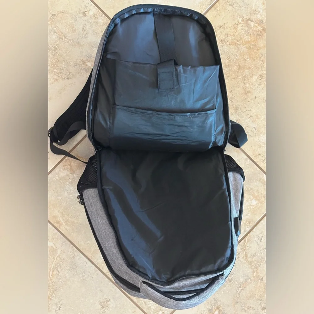 Backpack Excellent condition! Lots of zip compartments. Grey black. Clean!